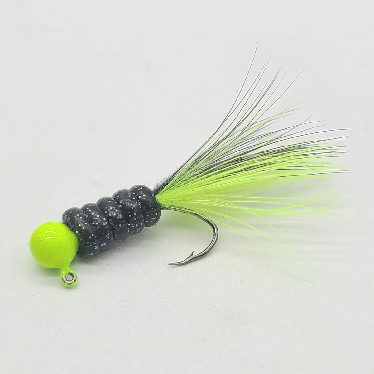 Hand tied Crappie jig, jelly belly jig with a black and silver flake  colored soft plastic body and a chartreuse marabou tail. The round jig head is custom painted with yellow chartreuse powder paint . The Crappie jig is Hand tied on a mustad sickle hook by Ramble tamble tackle.