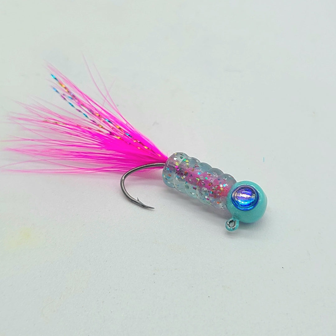 Hand tied Crappie jig, jelly belly jig with a blue and rainbow flake colored soft plastic body and a pink marabou tail. The 3D eye Crappie jig head is custom painted with robins egg powder paint . The Crappie jig is Hand tied on a mustad sickle hook by Ramble tamble tackle.