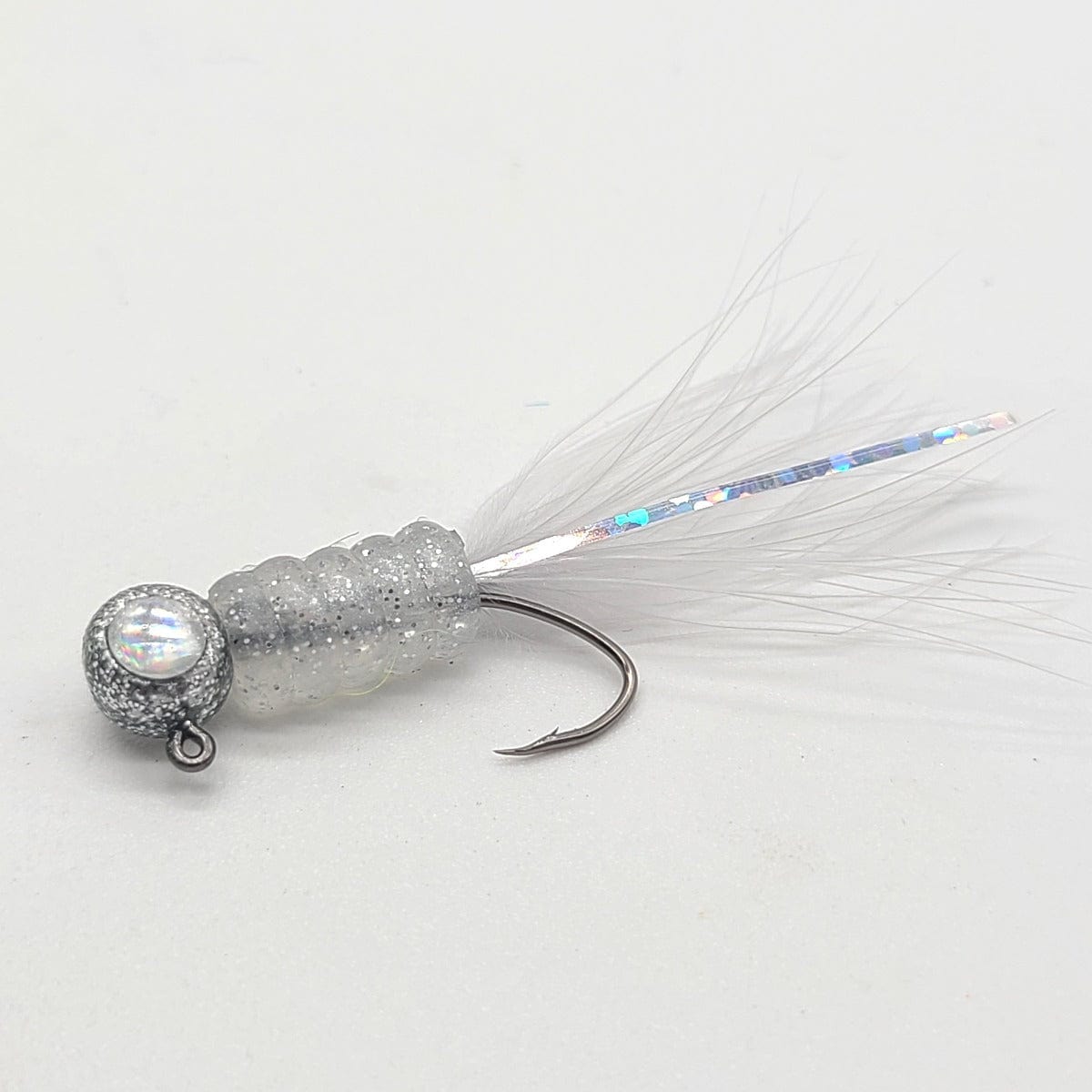 Hand tied Crappie jig, jelly belly jig with a pearl and silver flake colored soft plastic body and a gray marabou tail. The 3D eye Crappie jig head is custom painted with Disco Silver powder paint . This Crappie jig is Hand tied on a mustad sickle hook by Ramble tamble tackle.