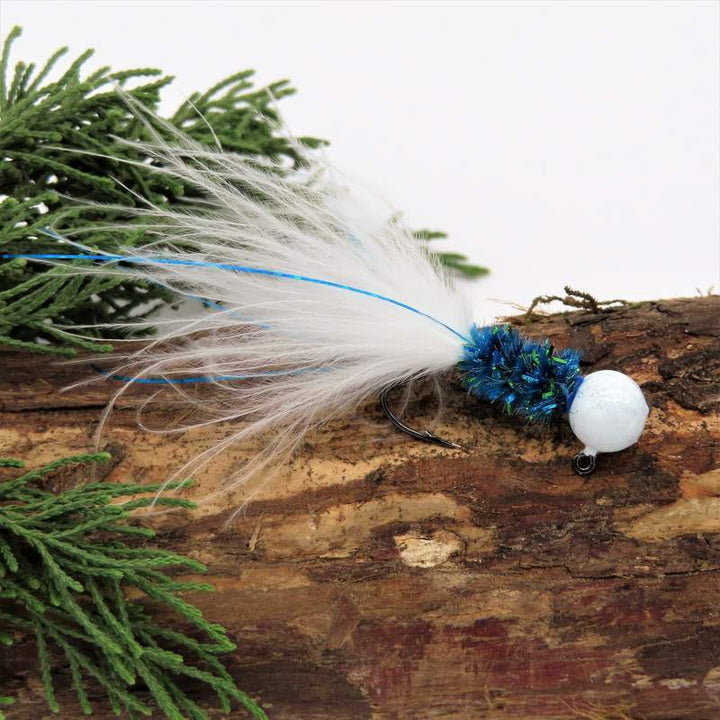 Hand tied Crappie jig featuring a Round White jig head,new age chenille body in mahi blue, white marabou tail and silver flash. Hand tied onto a #4 Mustad sickle hook by Ramble Tamble Tackle.