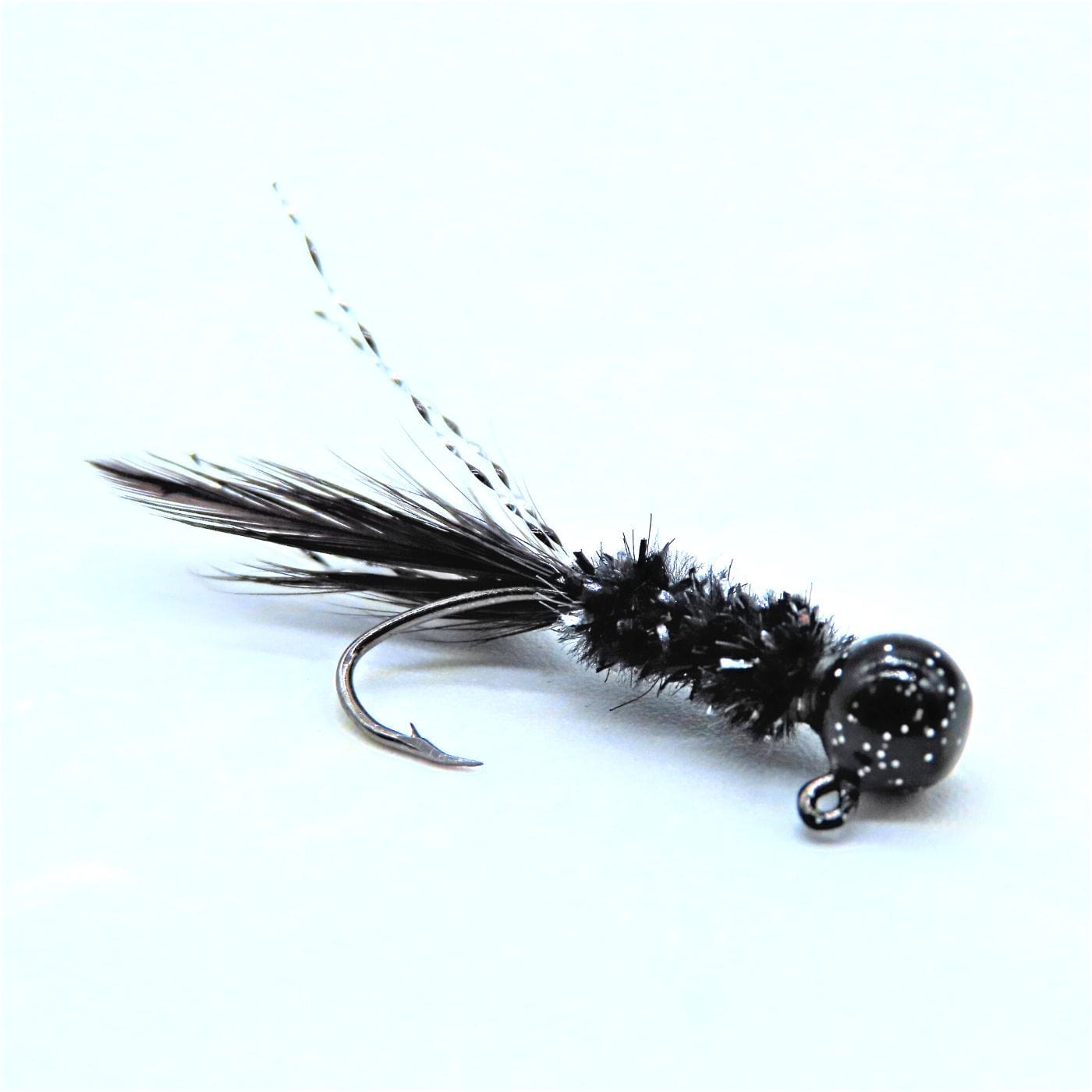 Hand tied Crappie jig featuring a Round black jig head,black and silver flash chenille, black hackle tail and silver krystal flash. Hand tied onto a #4 Mustad sickle hook by Ramble Tamble Tackle.
