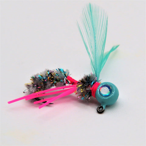 Hand tied Crappie jig. Hornet or wasp imitation. The body is blue/rainbow with aqua wings, and a aqua powder coated jig head. This Crappie jig is approx 1.5" in length and tied onto a #4 sickle hook by Ramble Tamble Tackle.