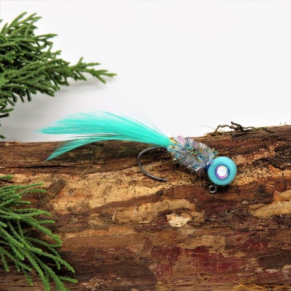 Hand tied Crappie jig featuring a Robins Egg head, blue 3D eyes, bridgeport special body chenille by Woods and Water, blue minnow hackle tail, and silver flash. Hand tied onto a #4 Mustad sickle hook by Ramble Tamble Tackle.